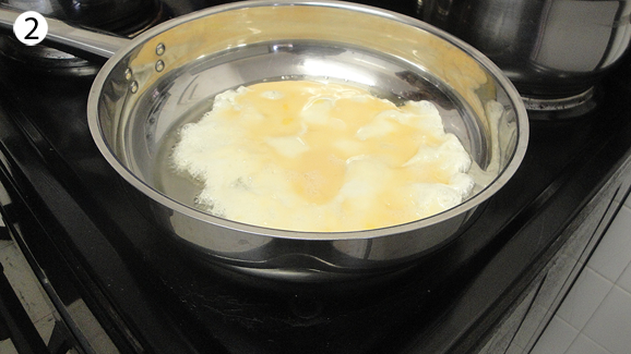 Heat oil in pan. Add the eggs and stir as though you are making scrambled eggs. As soon as they seem done, take them out of the pan and put them in a plate or bowl and set aside.