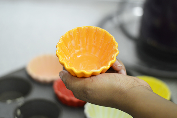 Grease your muffin tray or liners and set it aside